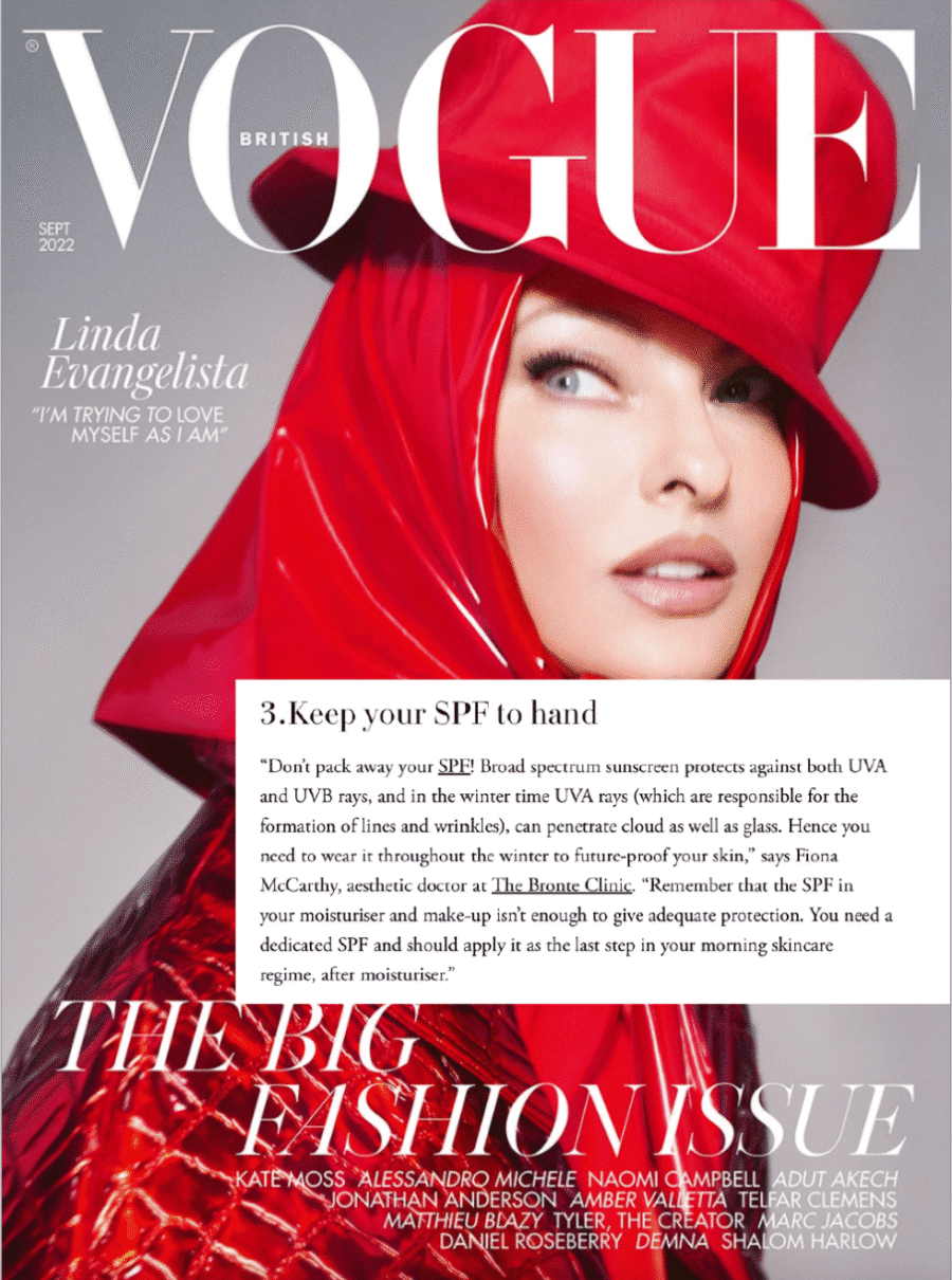 Cover of British Vogue, September 2022. Supermodel in a shiny red hooded outfit with bold make-up. Text overlay discusses sun protection and skincare, with white and red headline typography.