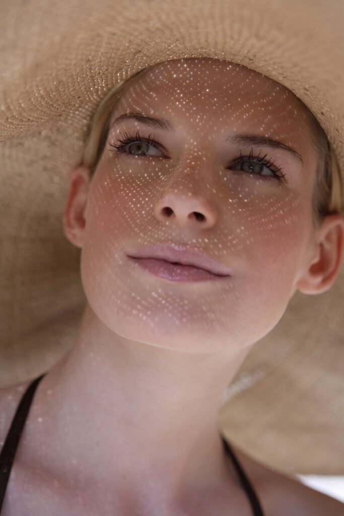 woman wearing a hat thinking about treatments for dehydrated skin